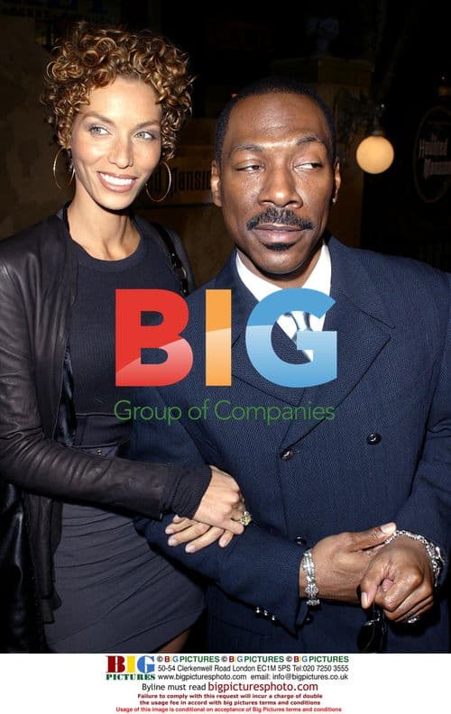 Eddie Murphy and Wife at Haunted Mansion Premiere