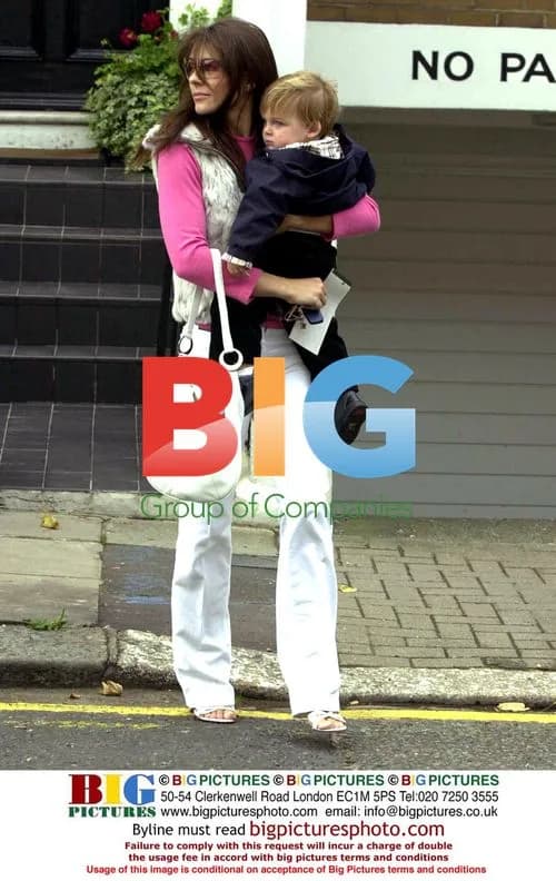 Liz Hurley leaving house with son