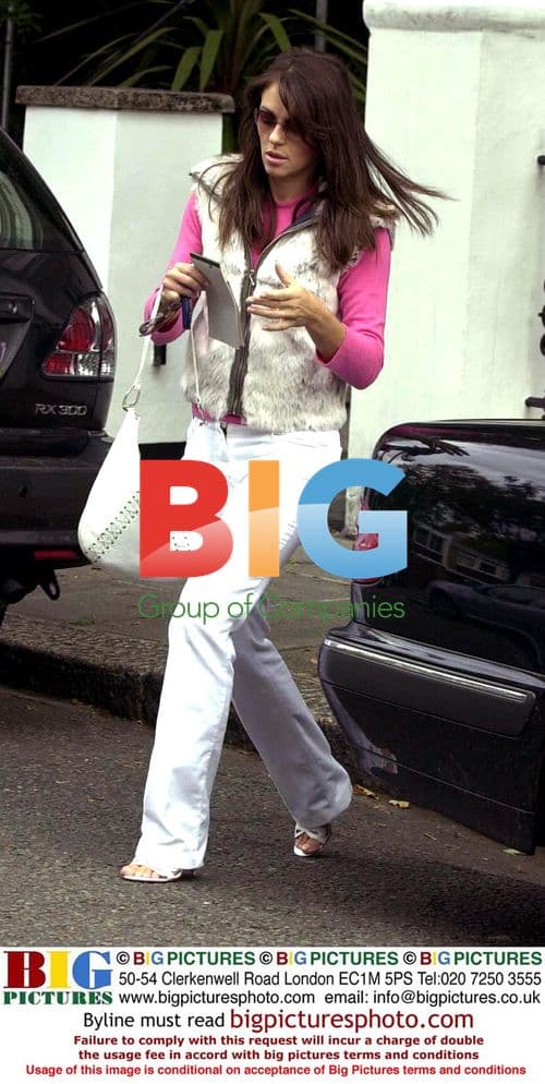 Liz Hurly putting son into car in London