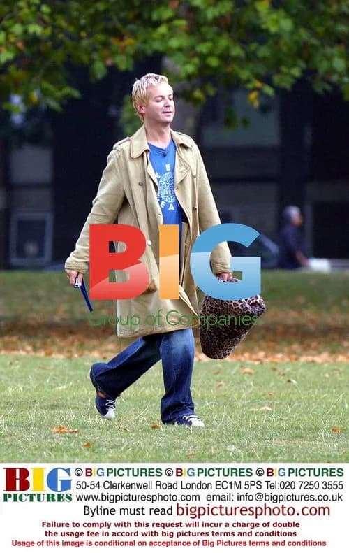 Julian Clary and dog in park