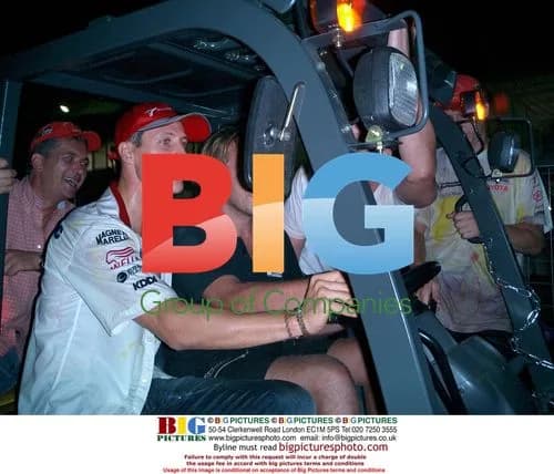 Michael Schumacher drives fork lift at Japanese GP
