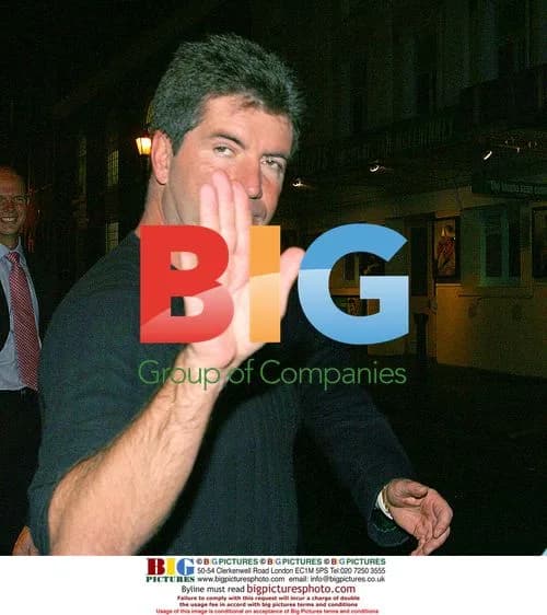 Simon Cowell Signing Autographs