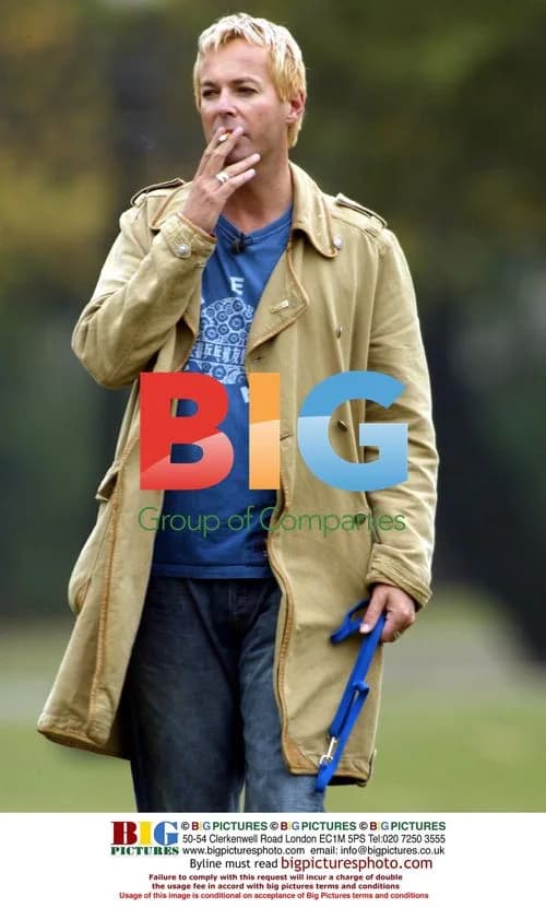 Julian Clary with dog Valerie in North London park