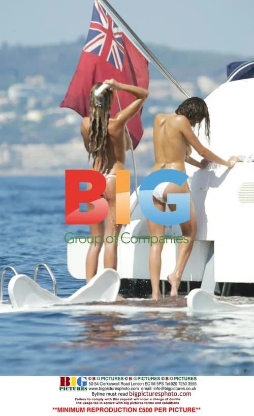 Model Jordan and friend Jerri Byrne water pistol fight on yacht