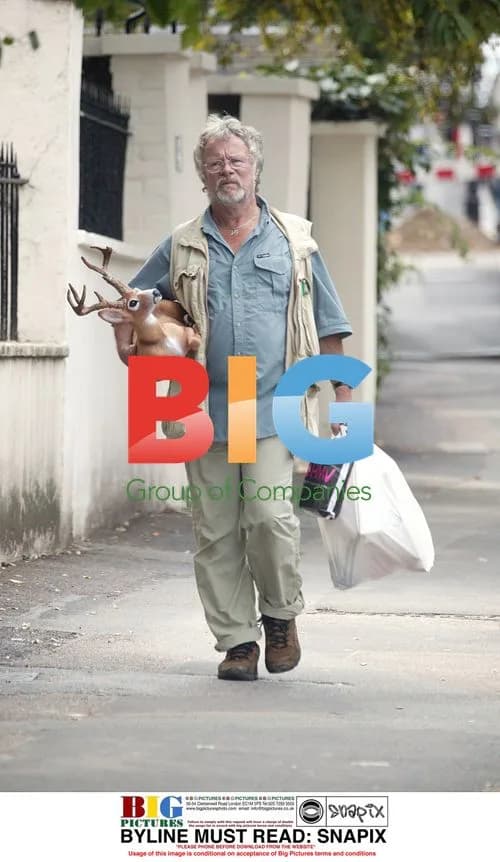 Bill Oddie Carrying Deer in North London
