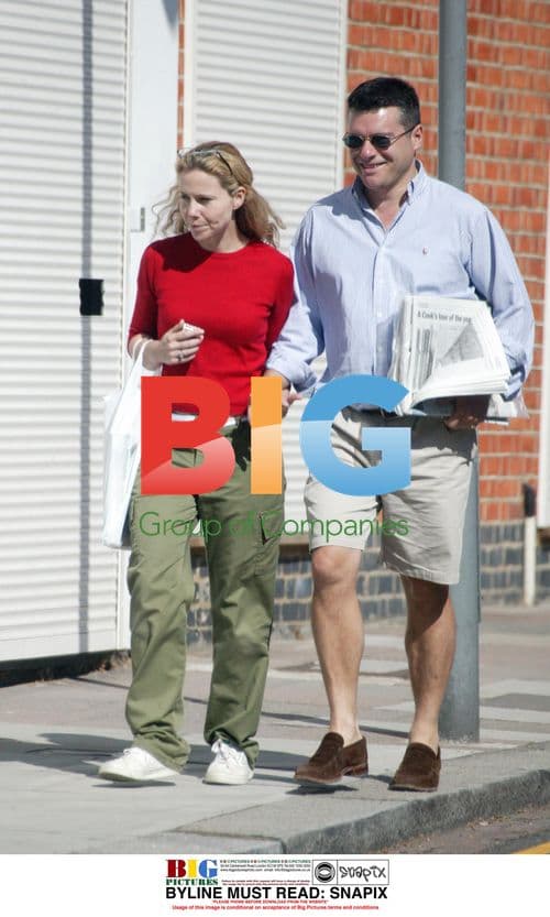 TV Comedian Sally Phillips and Husband Stroll in London
