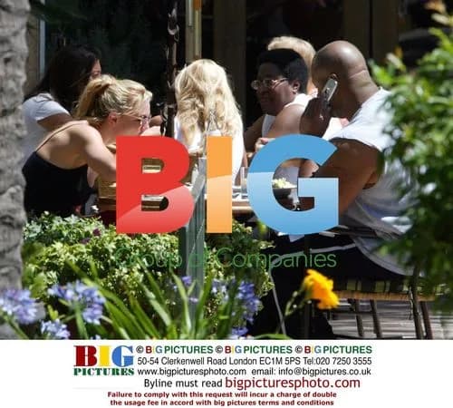 Britney Spears Stretching After Meal with Bodyguard