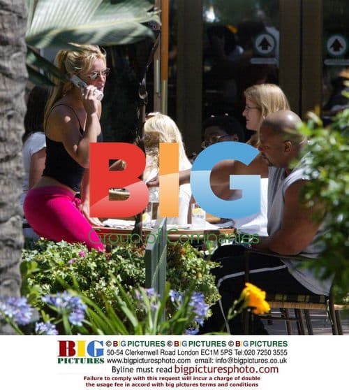 Britney Spears stretches after meal