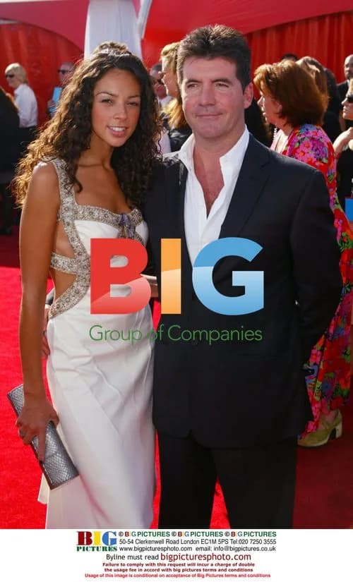 Simon Cowell & guest at 2003 Emmys