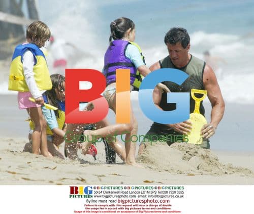 Sylvester Stallone Plays on Beach with Family