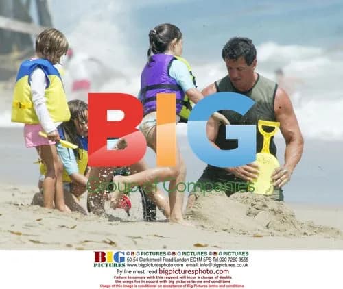 Sylvester Stallone Plays on Beach with Family
