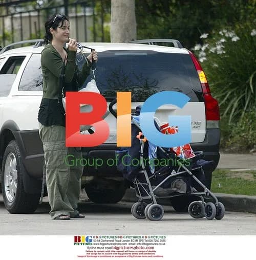 Carrie Anne Moss out with baby in LA