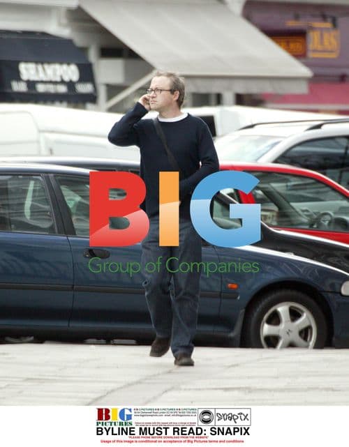 Harry Enfield Chatting on Phone in London