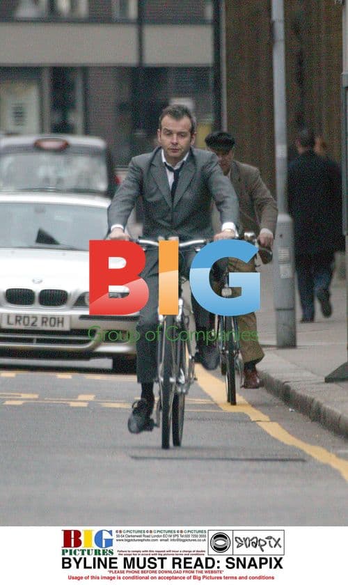 Musician Piers Adams Riding Bike in London
