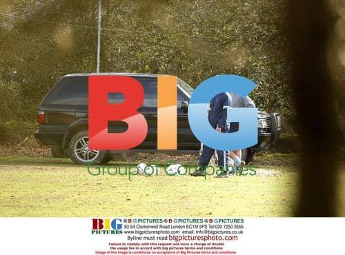 Robbie Williams and friend Jonathan Wilkes play football