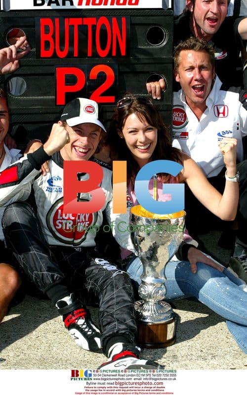 Jenson Button celebrates with girlfriend