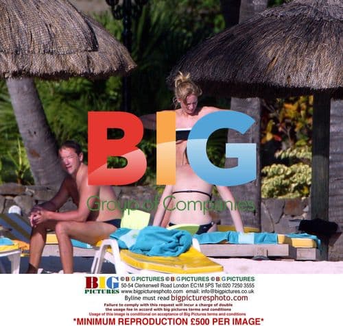 Joanna Taylor Relaxing at Beach Resort