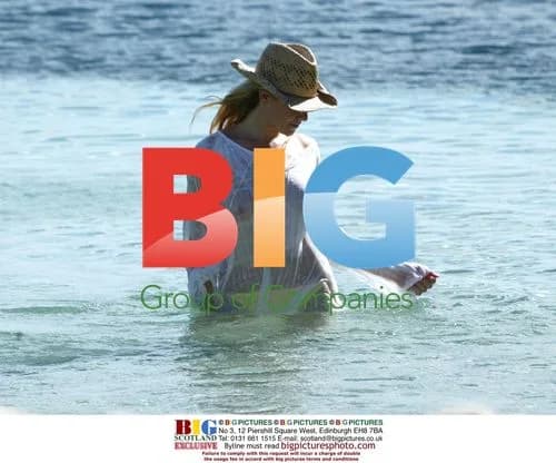 Abi Titmuss Practicing Yoga on Beach