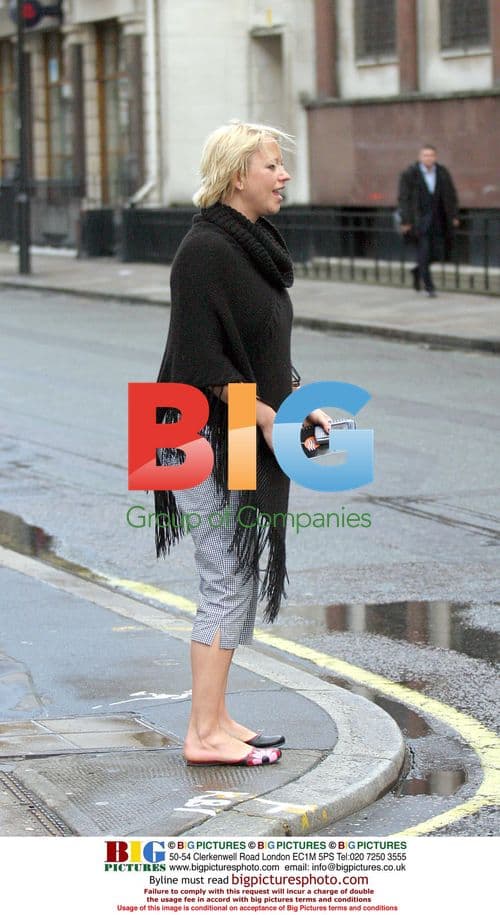 Pregnant DJ Sara Cox Hailing Taxi in London