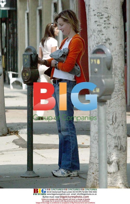 Calista Flockhart Running Back to Car