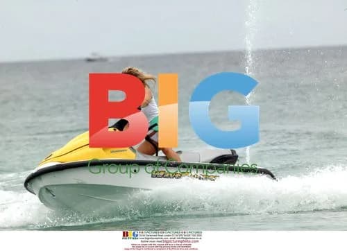 Abi Titmuss riding a jet ski