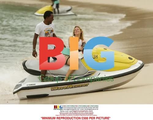 Abi Titmuss Rides Jet Ski on Beach
