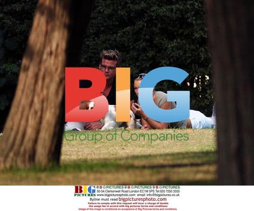 Model Nell McAndrew and TV Host Phil T Relaxing in Park