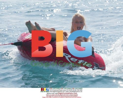 Glamour model Anna Taverner on donut in France