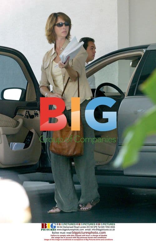 Lisa Kudrow Leaves Car with Papers in Beverly Hills