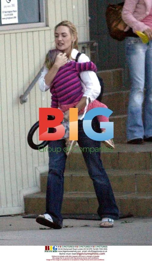 Kate Winslet fights wind with daughter Mia