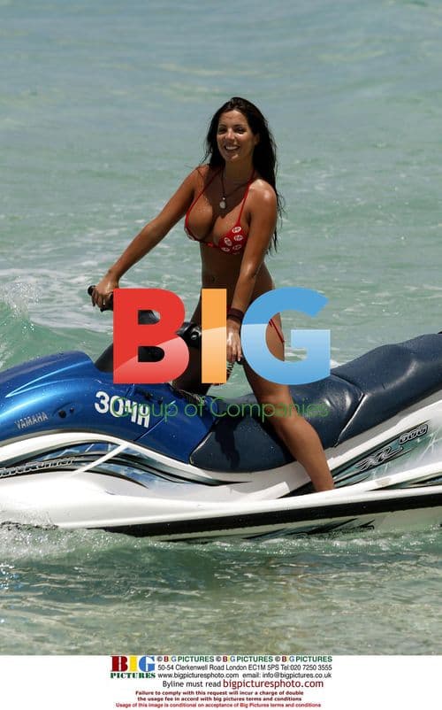 Coralie rides jetski on Caribbean holiday