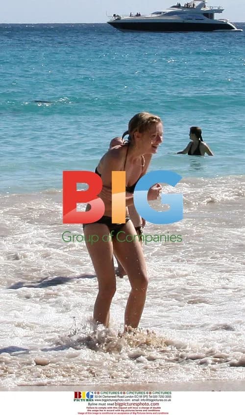 Kirsten Dunst Relaxing on Beach
