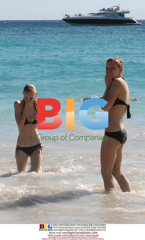 Kirsten Dunst Body Surfing on Beach