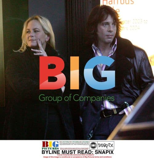 Celebrity Designer Waits for Cab Outside Harrods