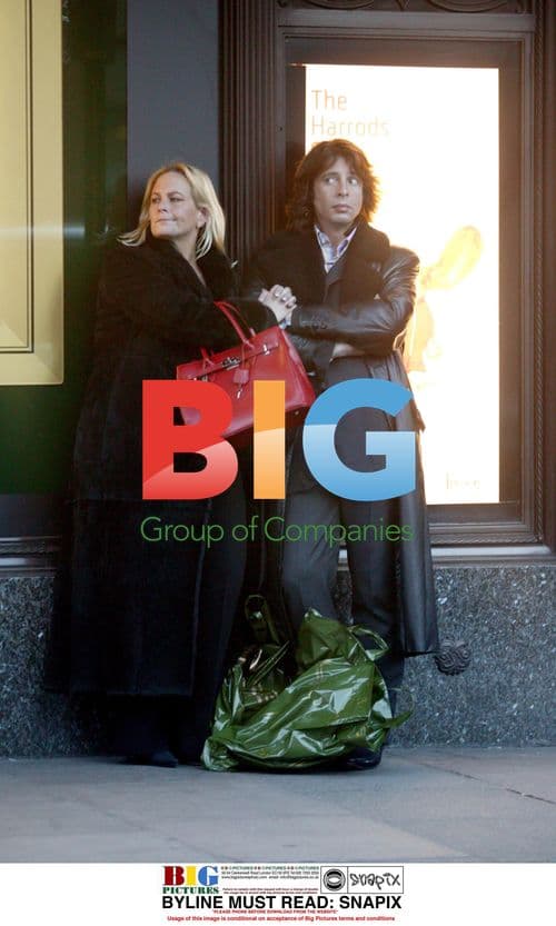 Celebrity Designer Waits for Cab Outside Harrods