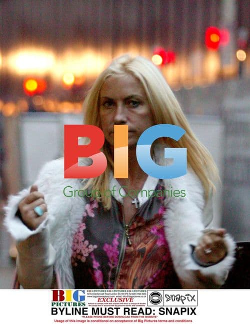 Meg Matthews Hailing Cab in London