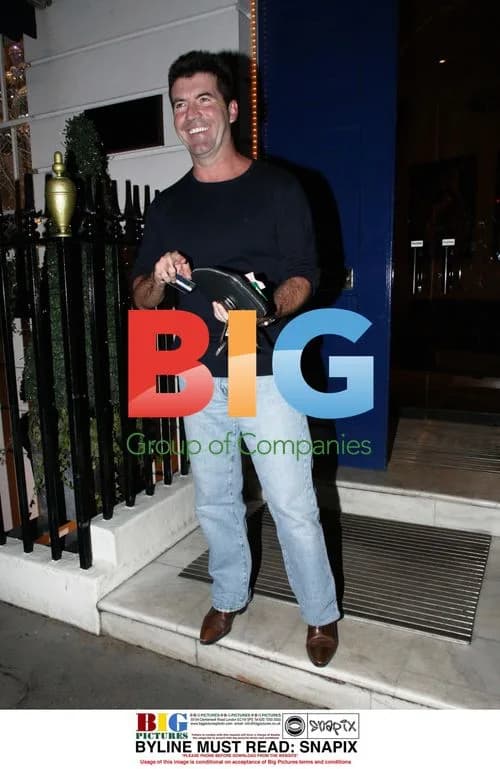 Simon Cowell Gets Haircut in London