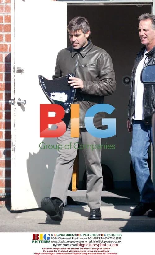George Clooney riding bike