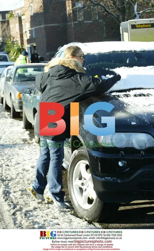 Patsy Kensit Clears Snow from Car