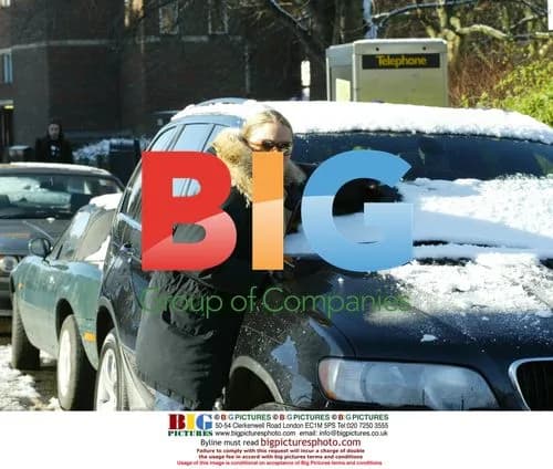 Patsy Kensit Clears Snow from Car