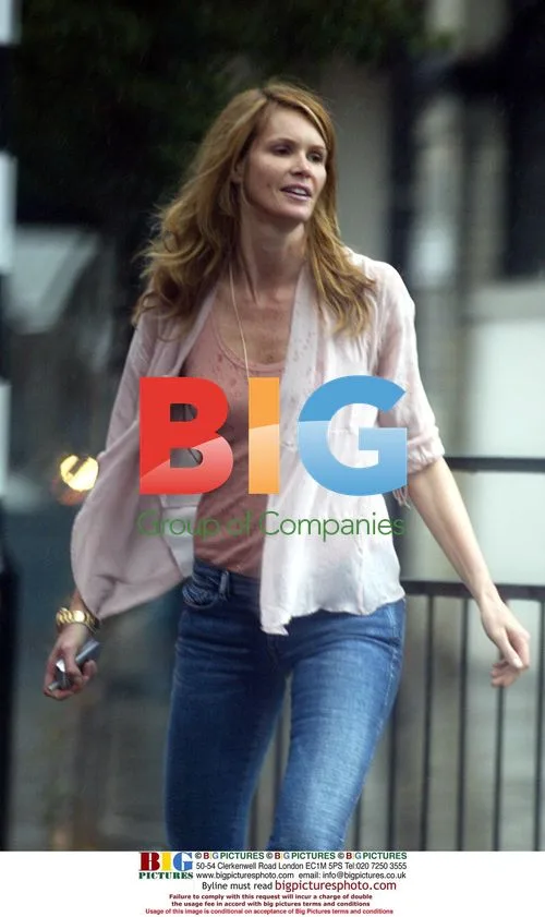 Elle McPherson with Mystery Man in London