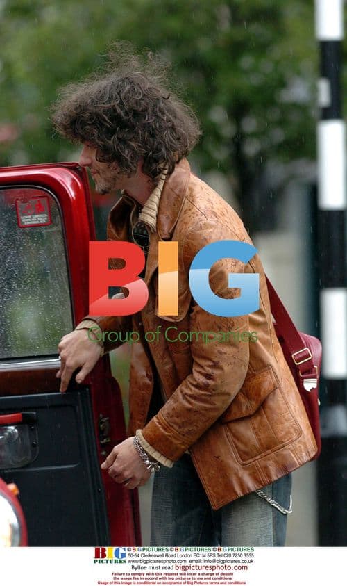 Elle McPherson with mystery man in Soho