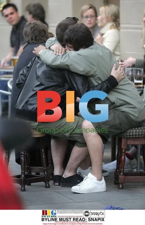 Liam Gallagher laughing with friends