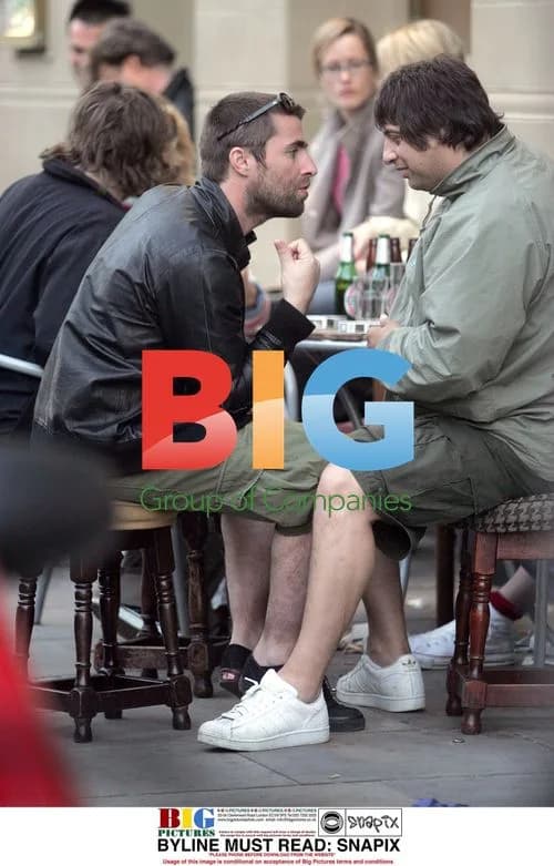 Liam Gallagher laughs with brother and friend