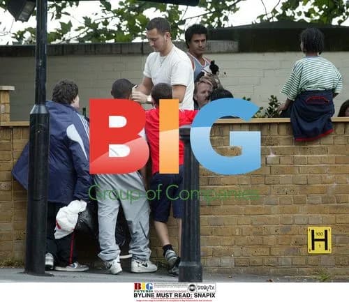Chris Moyles, Jeremy Edwards and Will Mellor with autograph-seeking children
