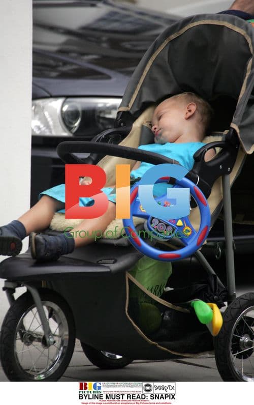 Mike Atherton takes baby for walk in London