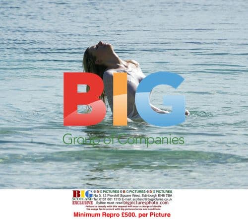 Abi Titmuss Practicing Yoga on Beach