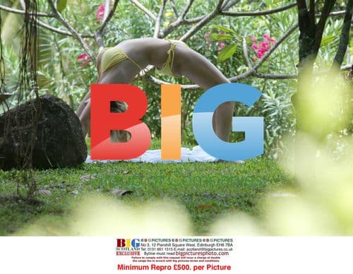 Abi Titmuss Relaxing on Beach