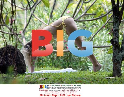 Abi Titmuss Practicing Yoga on Beach