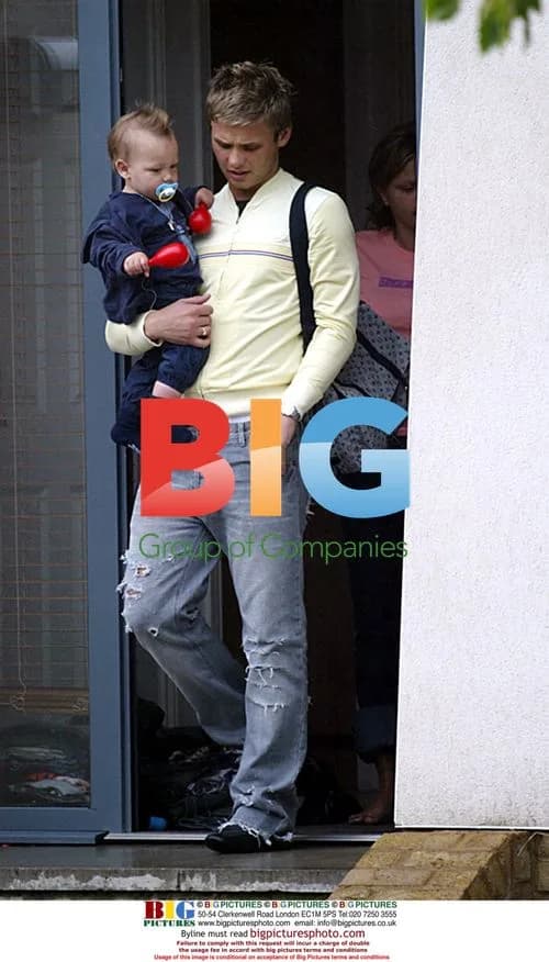 Jeff Brazier picking up baby Bobby Jack